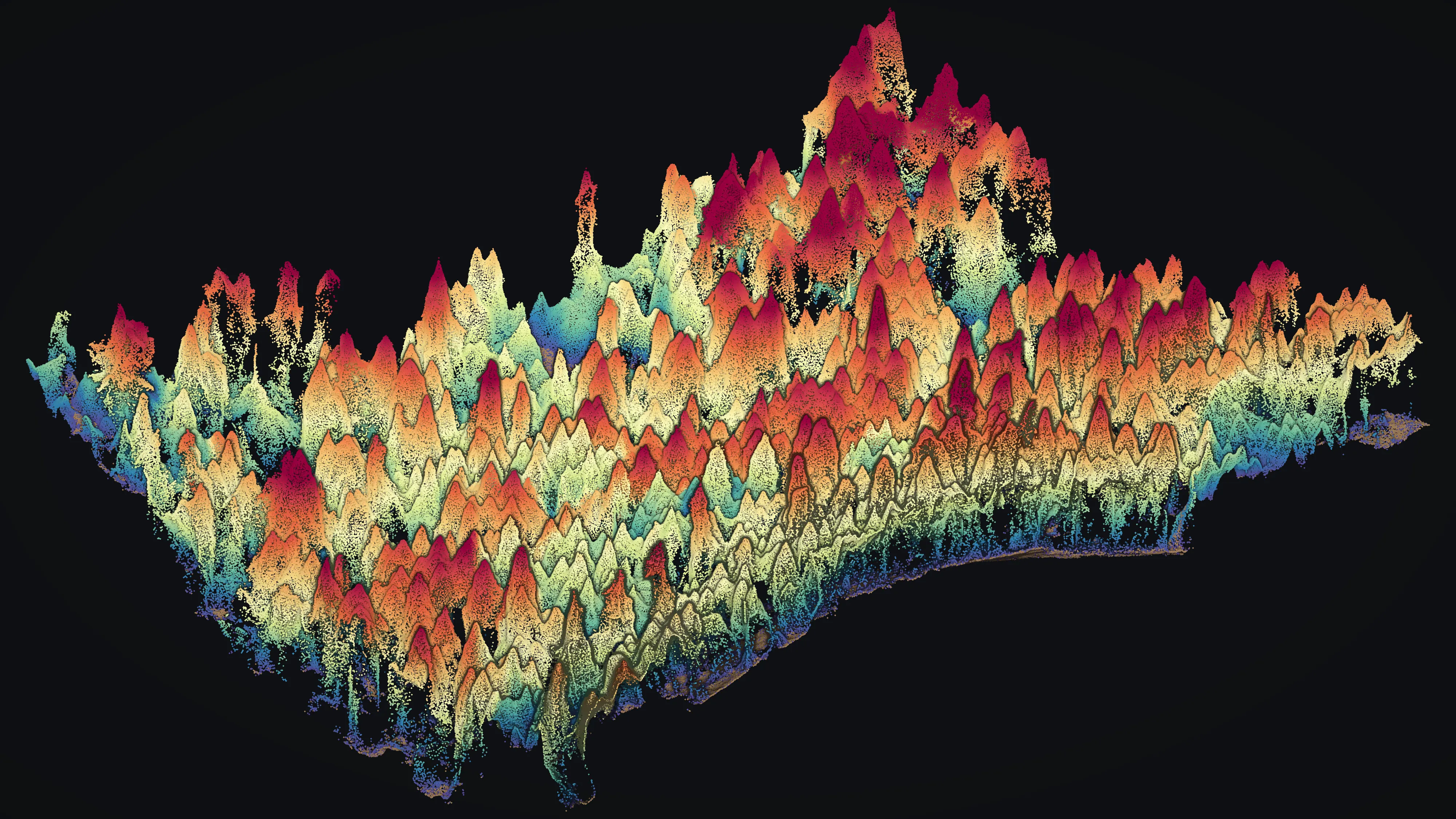 A stand of conifer forest drawn from a drone point cloud, every return coloured by how far above the ground it sits: the ground itself tan, low brush blue and green, the tallest crowns red, each tree standing as a separate spire.
