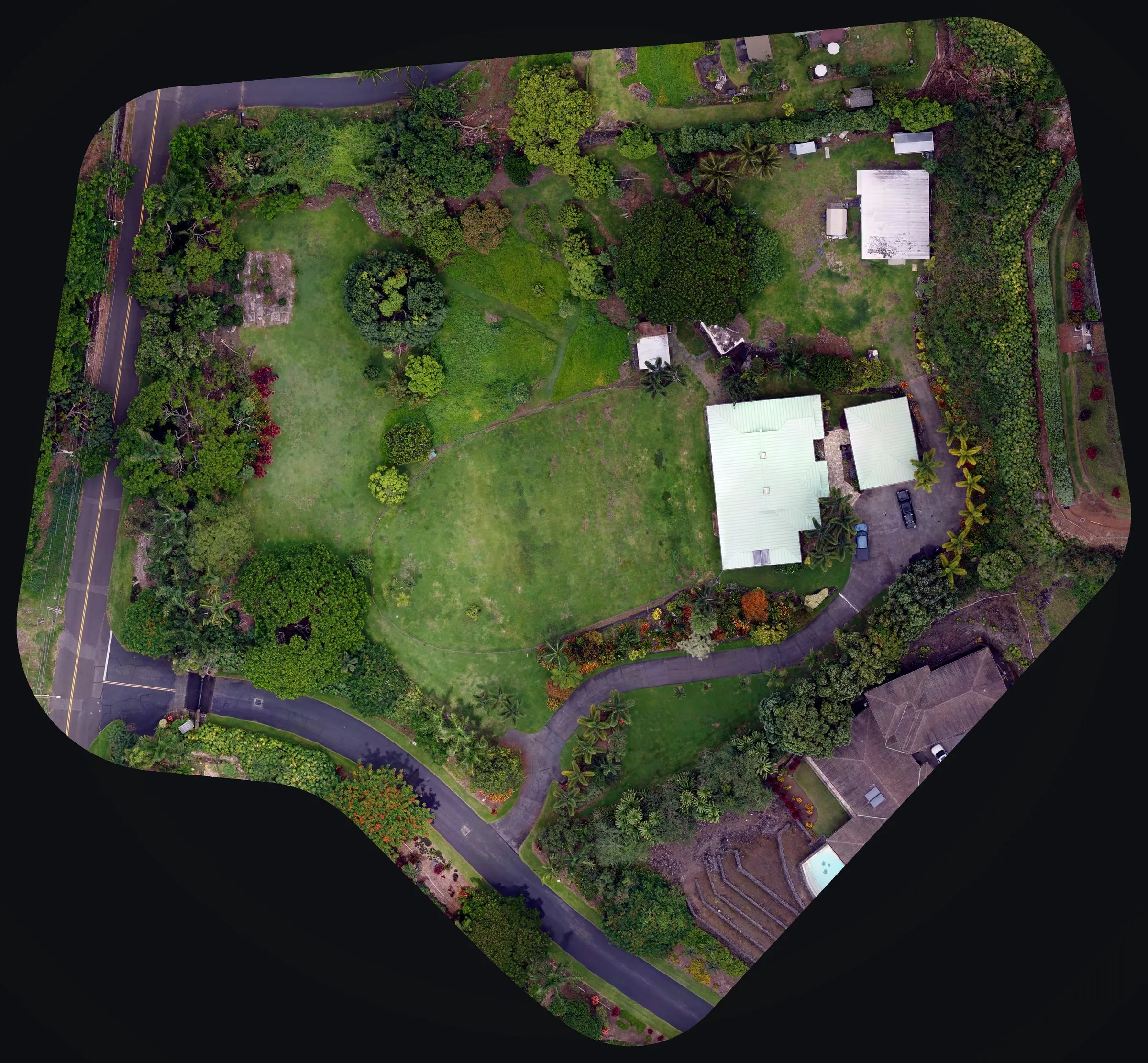 The whole parcel photographed from the air on the same flight as the LiDAR: lawn, trees, the house and the drive.
